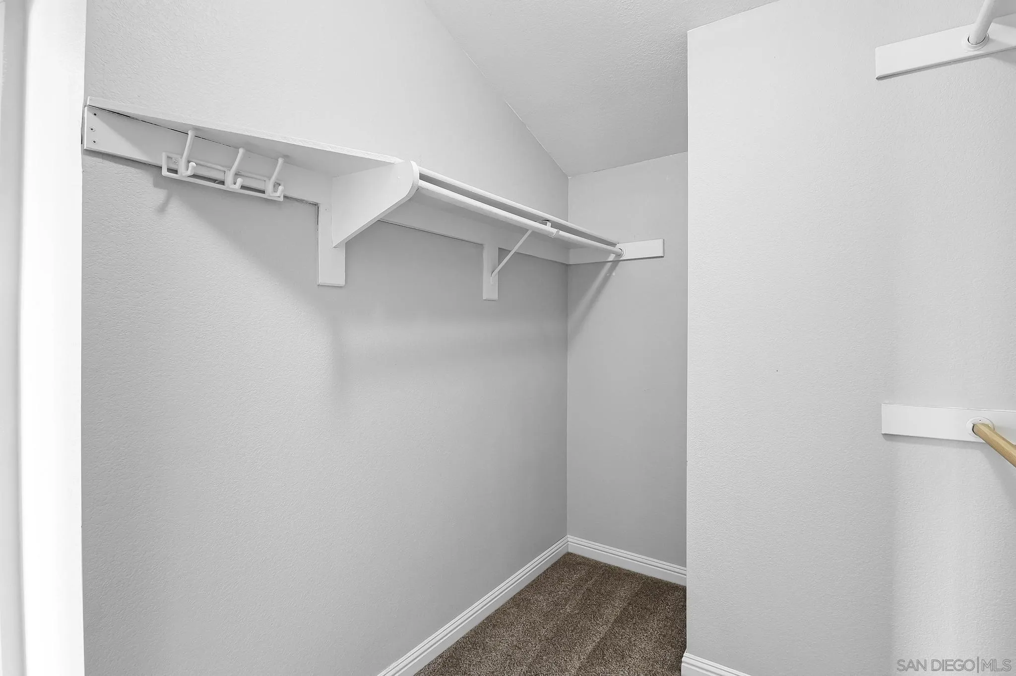 39884 North General Kearny Road Temecula, CA 92591 - Photo 42 of 58 a view of walk in closet with empty racks