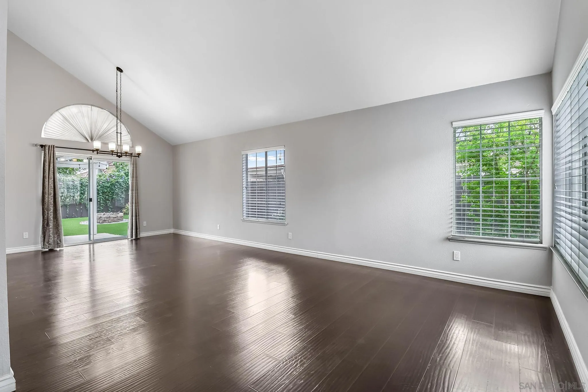 39884 North General Kearny Road Temecula, CA 92591 - Photo 5 of 58 a view of an empty room with wooden floor and a window