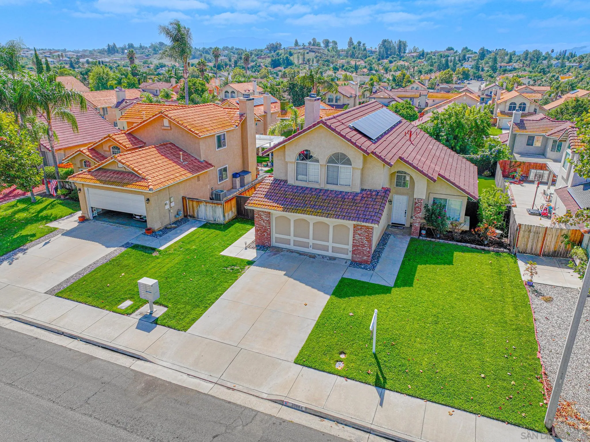 39884 North General Kearny Road Temecula, CA 92591 - Photo 52 of 58 an aerial view of a house with a garden and trees