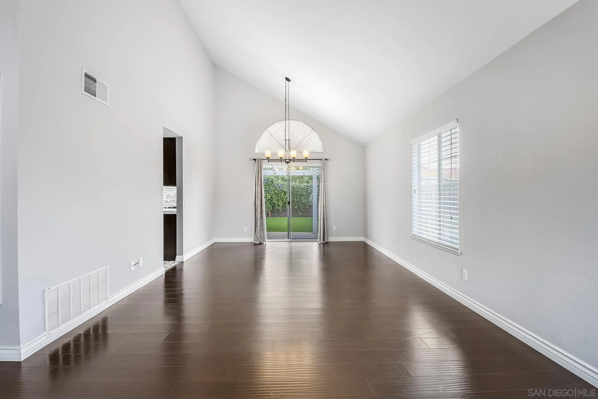 39884 North General Kearny Road Temecula, CA 92591 - Photo 7 of 58 an empty room with wooden floor and windows