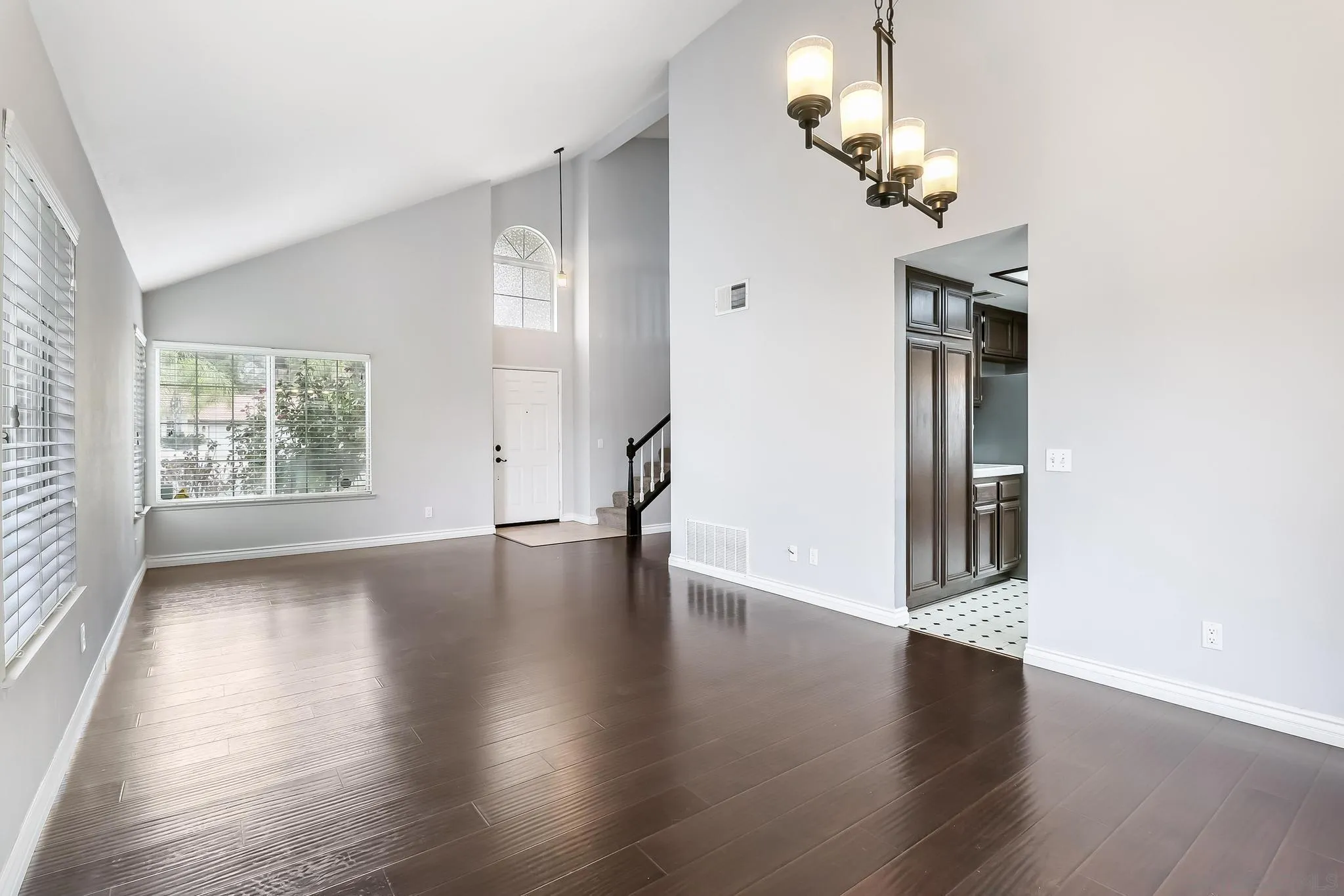 39884 North General Kearny Road Temecula, CA 92591 - Photo 8 of 58 an empty room with wooden floor chandelier and windows