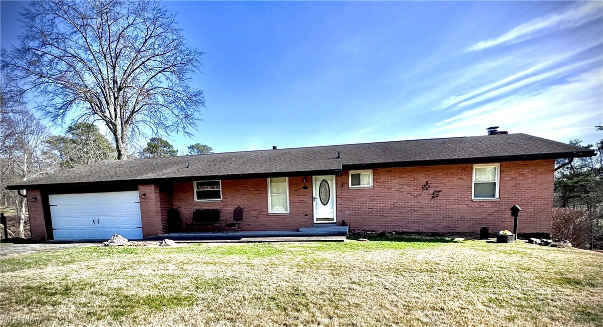 2361 Dutch Ridge Road Parkersburg, WV 26104 - Photo 1 of 17 Ranch-style house with a front yard and a garage