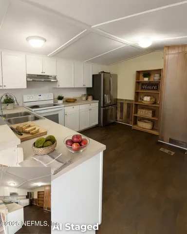 a kitchen with refrigerator and stove