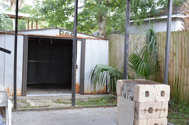 a front view of house with a garden
