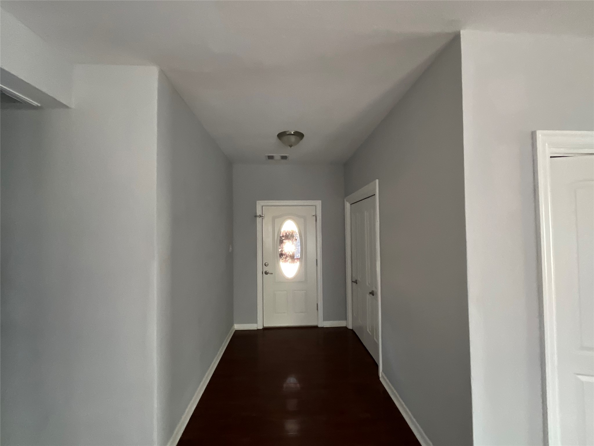 239 Old Firetower Road Bastrop, TX 78602 - Photo 18 of 39 Doorway to outside with baseboards and wood finished floors