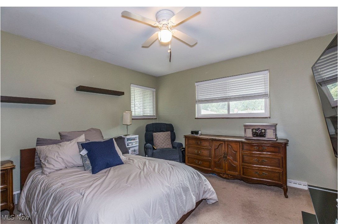 2095 Wyndham Road Akron, OH 44313 - Photo 23 of 40 Carpeted large bedroom with ceiling fan