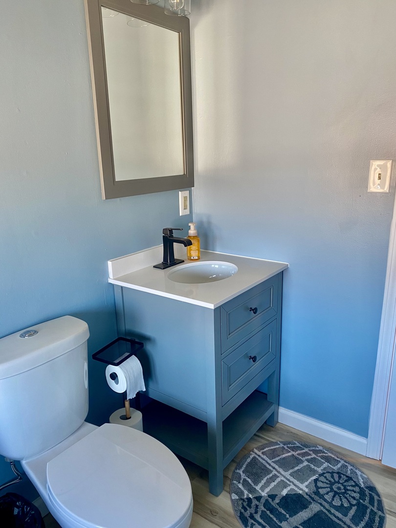 817 North 7th Street Rochelle, IL 61068 - Photo 11 of 14 a bathroom with a toilet a sink and mirror