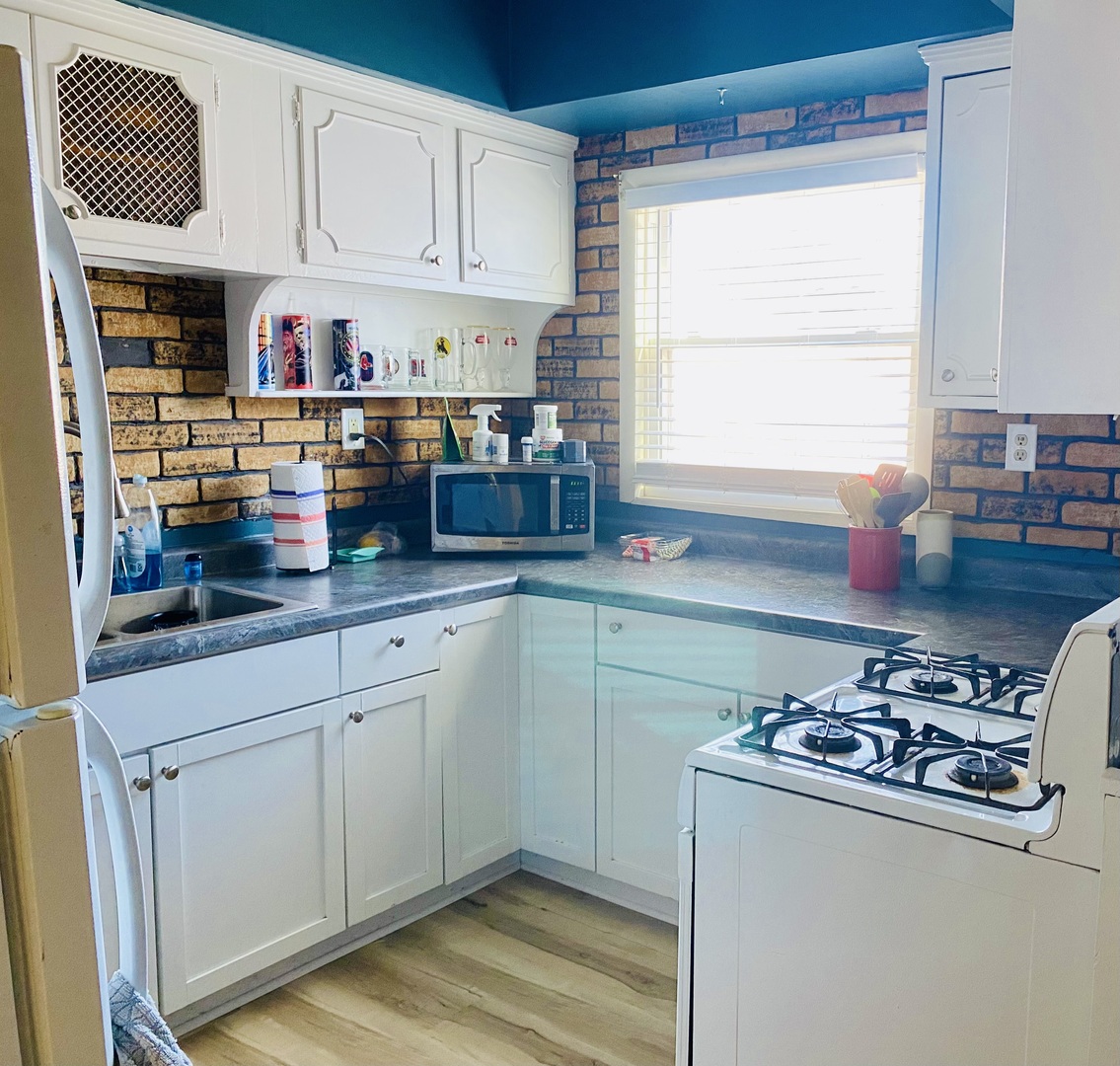 817 North 7th Street Rochelle, IL 61068 - Photo 3 of 14 a kitchen with stainless steel appliances granite countertop a stove and a refrigerator