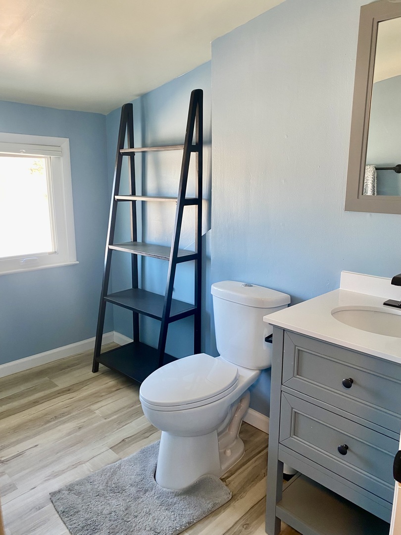 817 North 7th Street Rochelle, IL 61068 - Photo 10 of 14 a bathroom with a sink a toilet and a mirror
