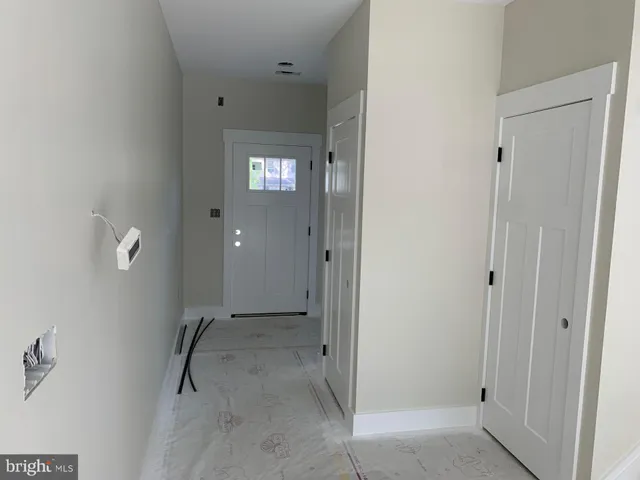 a view of a bathroom from the hallway