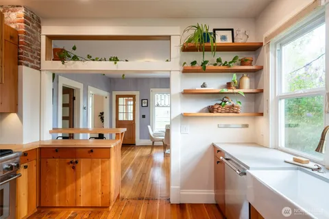 a kitchen that has a lot of cabinets in it