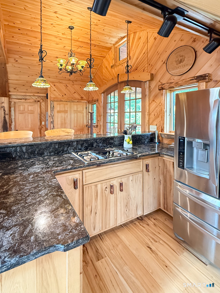 555 West Purchase Road Southbury, CT 06488 - Photo 4 of 15 a kitchen with stainless steel appliances granite countertop a sink and cabinets