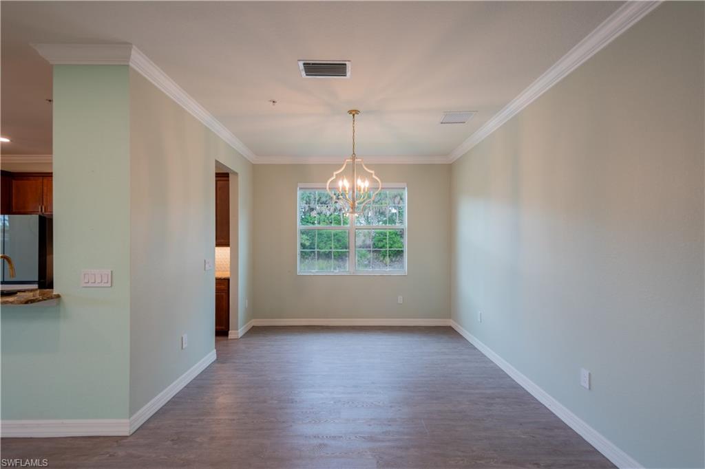 6533 Monterey Point, Unit 204 Naples, FL 34105 - Photo 13 of 41 a view of livingroom with window