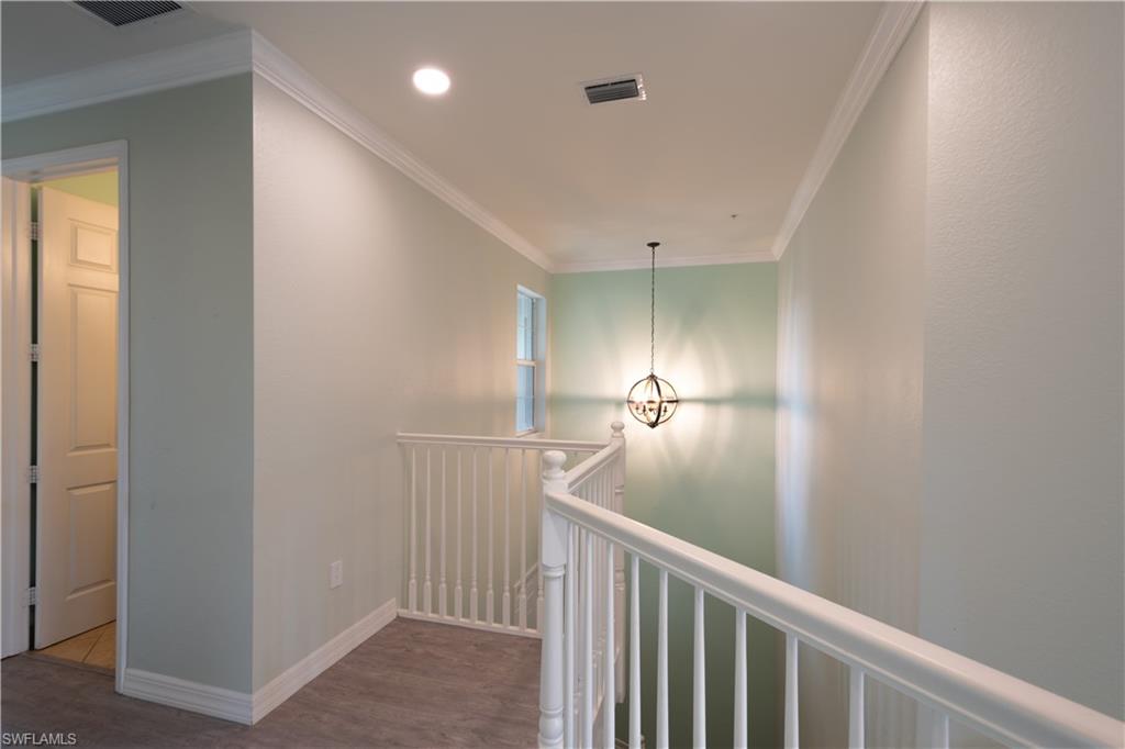 6533 Monterey Point, Unit 204 Naples, FL 34105 - Photo 16 of 41 a view of a hallway
