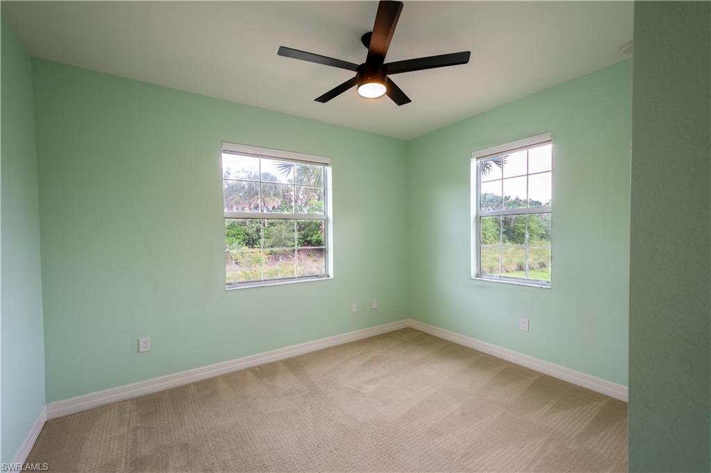 6533 Monterey Point, Unit 204 Naples, FL 34105 - Photo 19 of 41 an empty room with a window and a fan