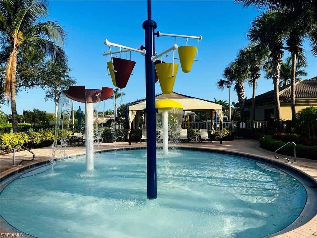 6533 Monterey Point, Unit 204 Naples, FL 34105 - Photo 35 of 41 a view of a house with swimming pool