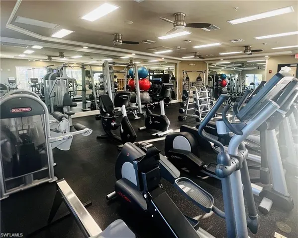 a living room with lots of furniture and a wooden floor