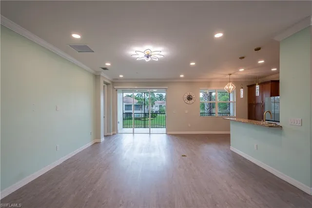 a view of a glass door and a balcony