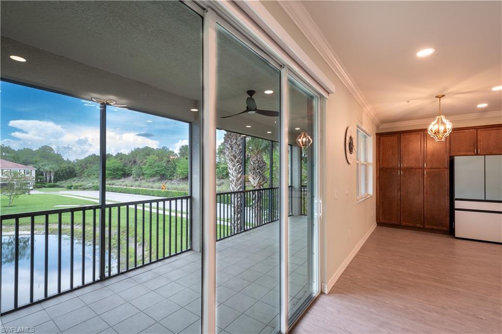 6533 Monterey Point, Unit 204 Naples, FL 34105 - Photo 6 of 41 a view of a glass door and a balcony
