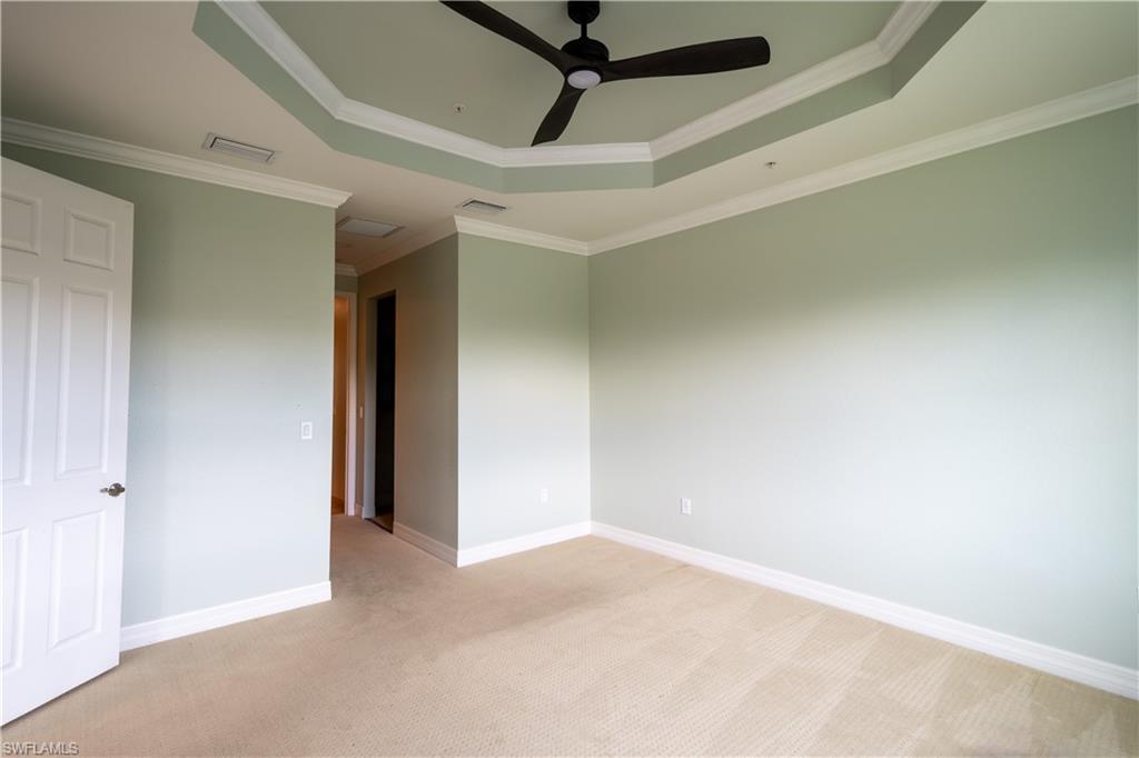 6533 Monterey Point, Unit 204 Naples, FL 34105 - Photo 10 of 41 a view of a room with a ceiling fan