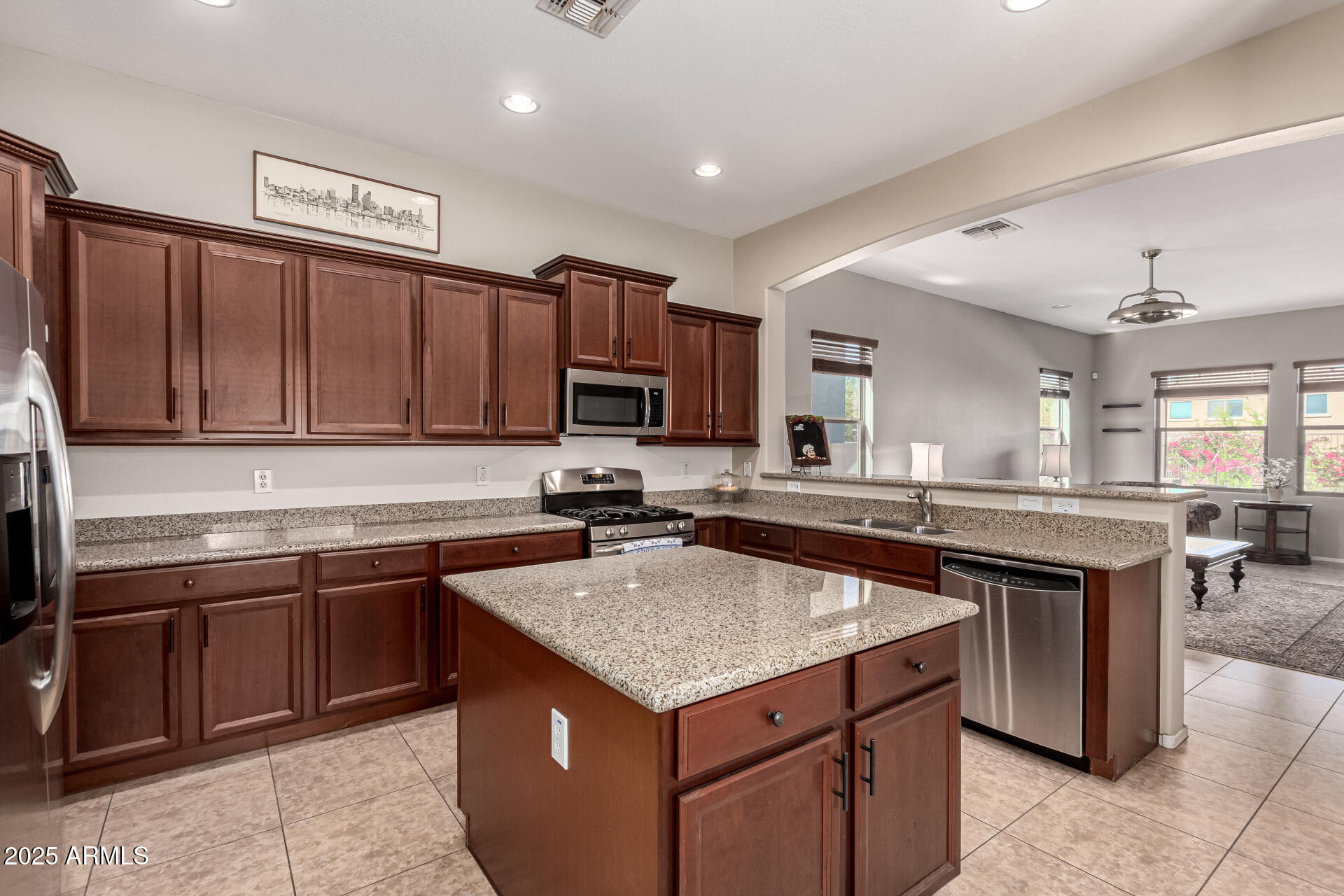 a kitchen with a stove sink and cabinets