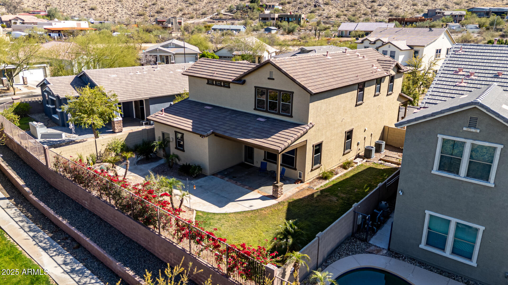 3914 East Constance Way Phoenix, AZ 85042 - Photo 2 of 81 an aerial view of a house with a yard