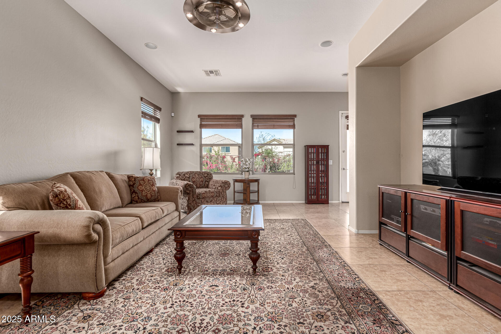3914 East Constance Way Phoenix, AZ 85042 - Photo 28 of 81 a living room with furniture and a flat screen tv