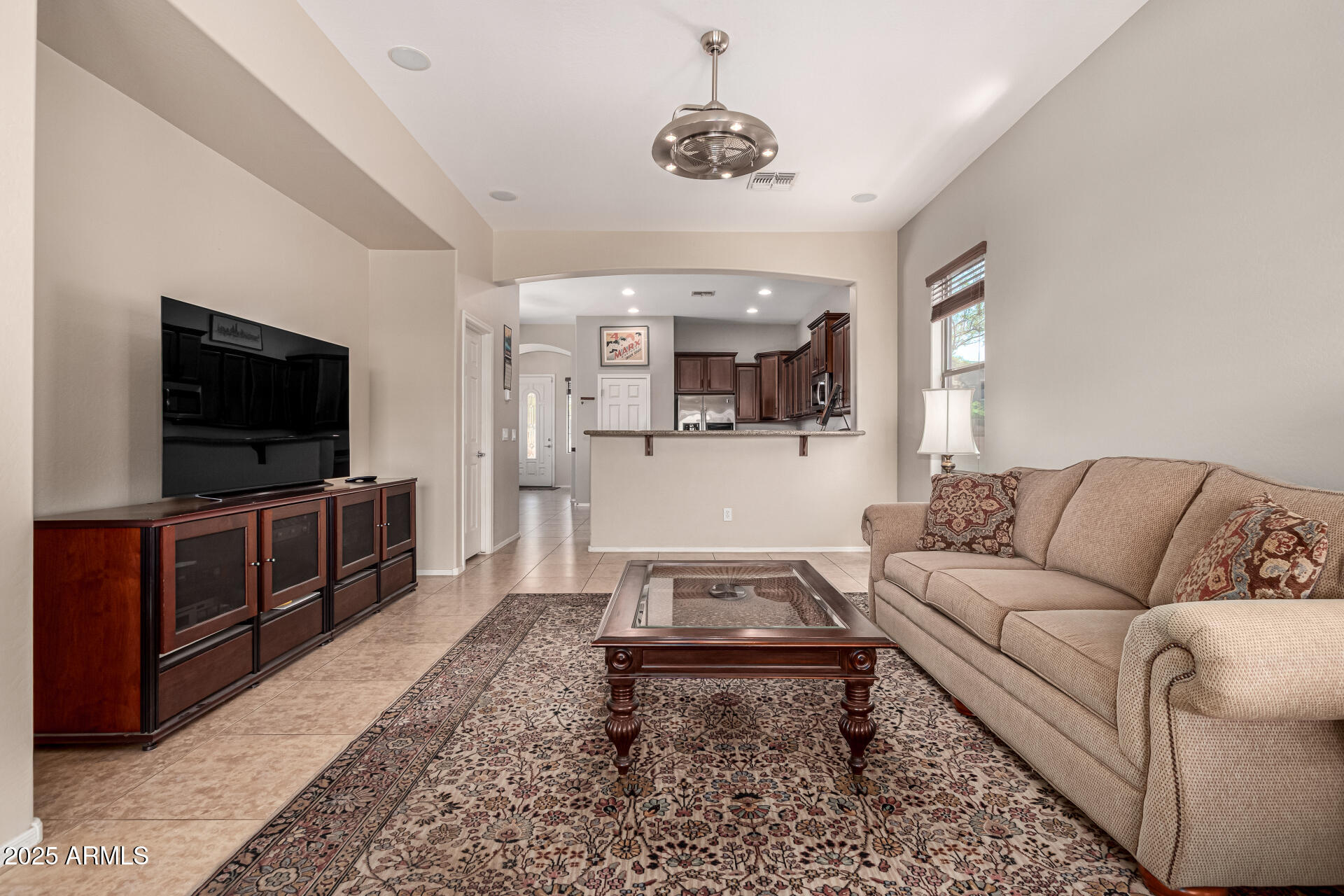 3914 East Constance Way Phoenix, AZ 85042 - Photo 30 of 81 a living room with furniture and a flat screen tv