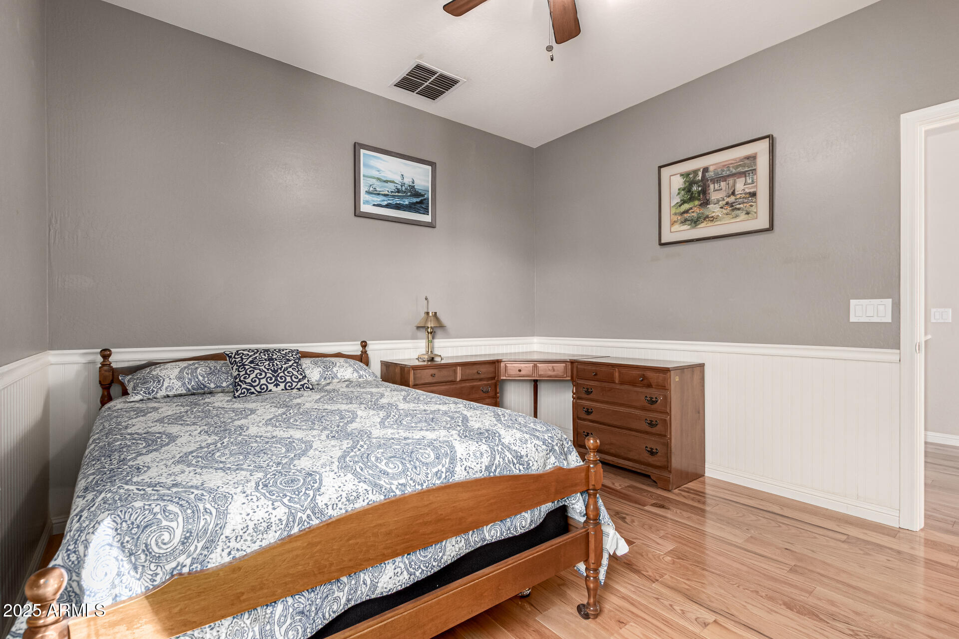 3914 East Constance Way Phoenix, AZ 85042 - Photo 45 of 81 a bedroom with a bed and wooden floor