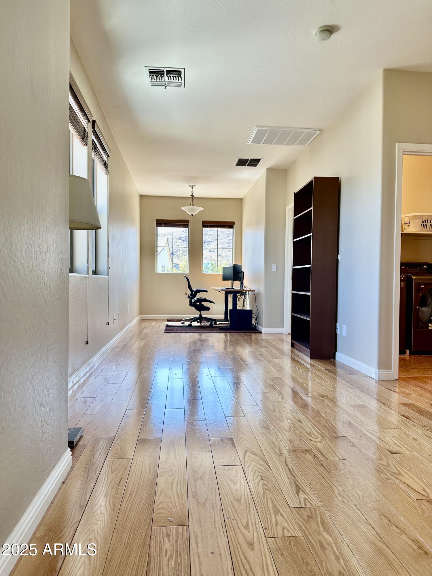 3914 East Constance Way Phoenix, AZ 85042 - Photo 5 of 81 a view of a living room with furniture and a wooden floor