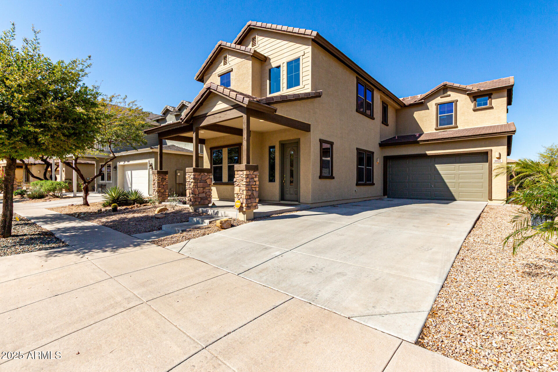 3914 East Constance Way Phoenix, AZ 85042 - Photo 8 of 81 a front view of a house with a yard
