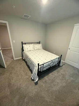 a bed sitting in a room
