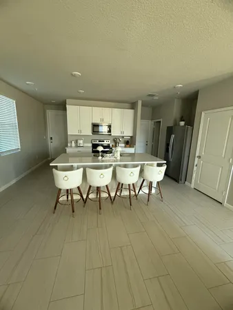 a view of a dining room with furniture and a rug