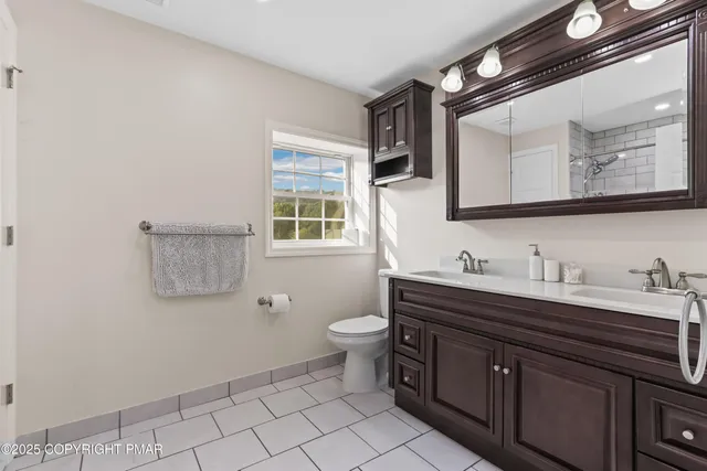 a bathroom with a shower and a bath tub