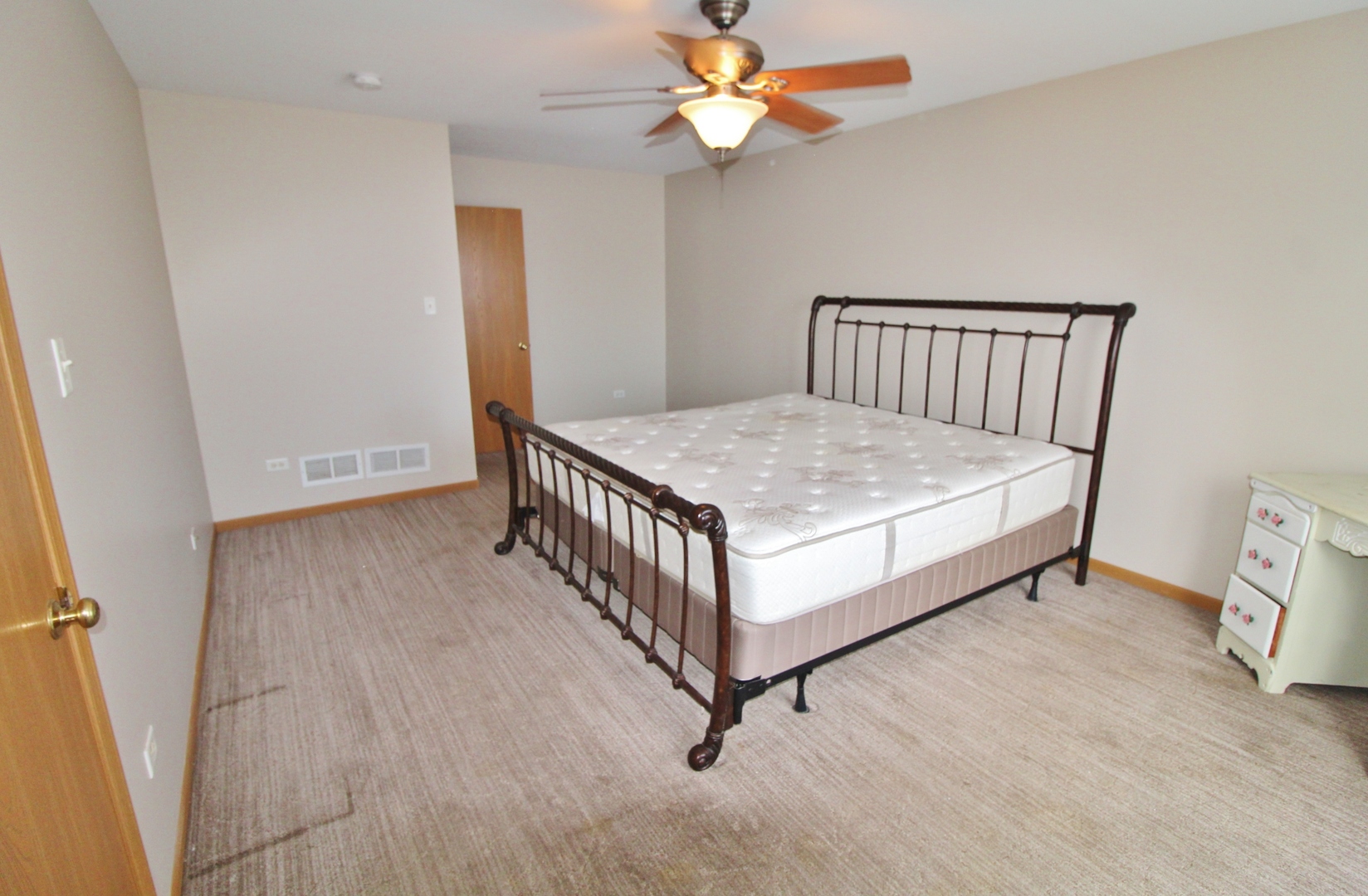 2005 Mountain Road Morris, IL 60450 - Photo 16 of 30 a bed room with a bed and a chandelier