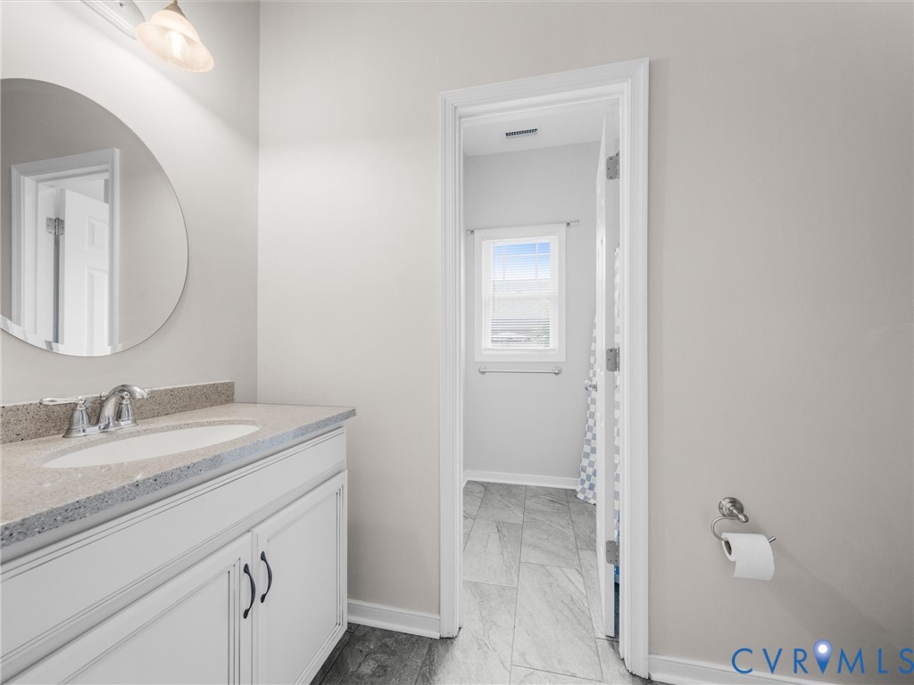 10824 Avening Road Chesterfield, VA 23832 - Photo 32 of 47 a bathroom with a granite countertop sink and a mirror