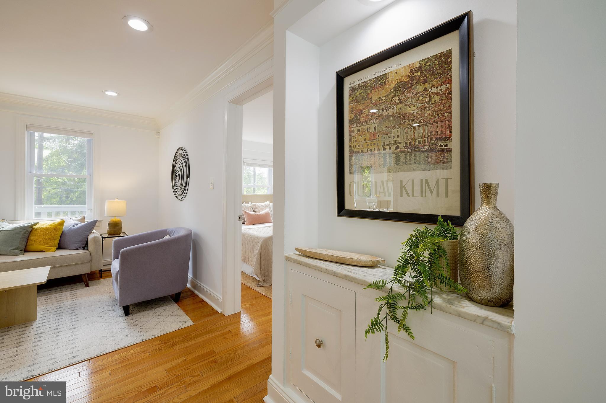 704 Maplewood Avenue Takoma Park, MD 20912 - Photo 22 of 54 a living room with furniture and a large window