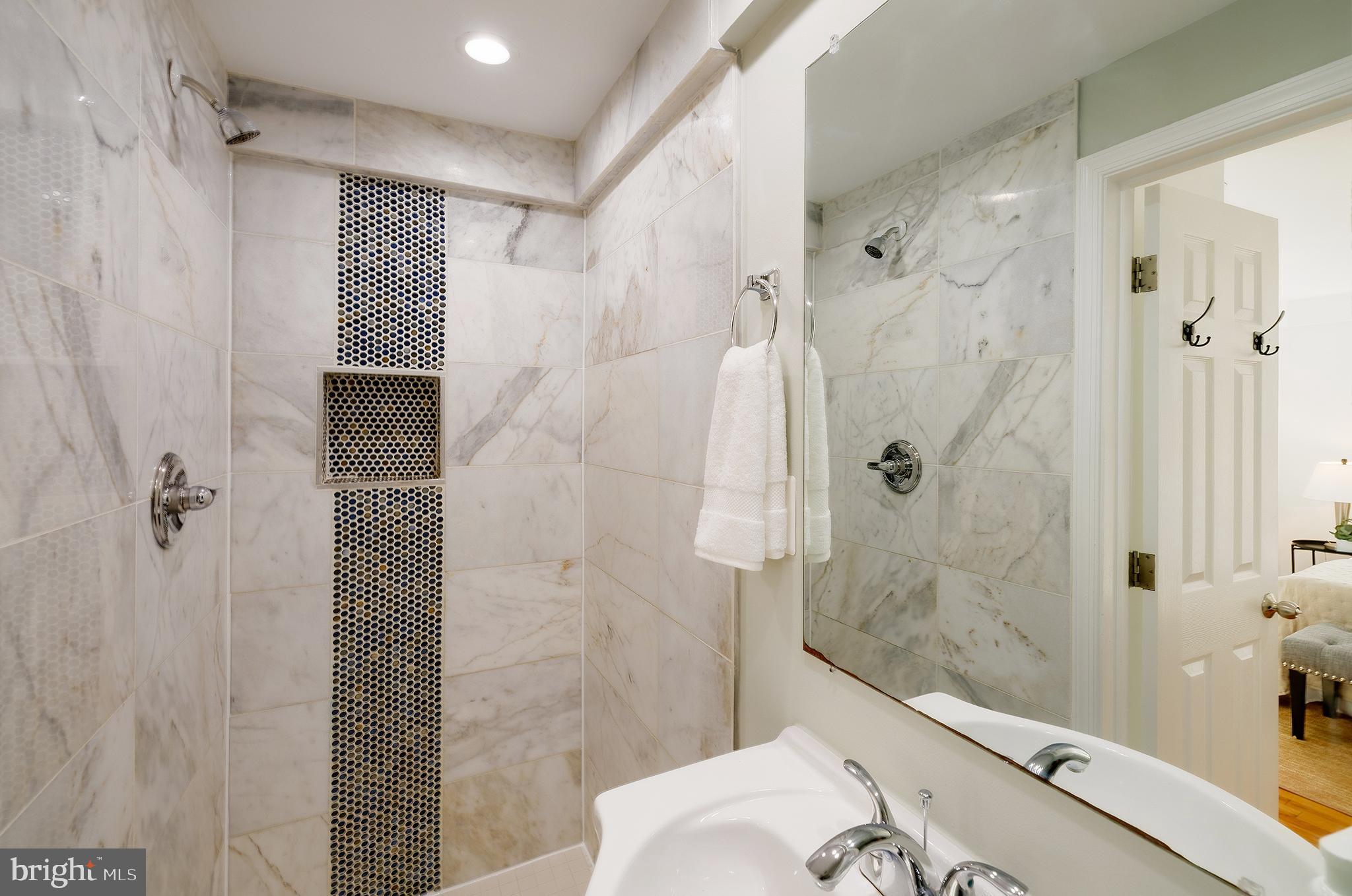 704 Maplewood Avenue Takoma Park, MD 20912 - Photo 26 of 54 a bathroom with a shower and a toilet