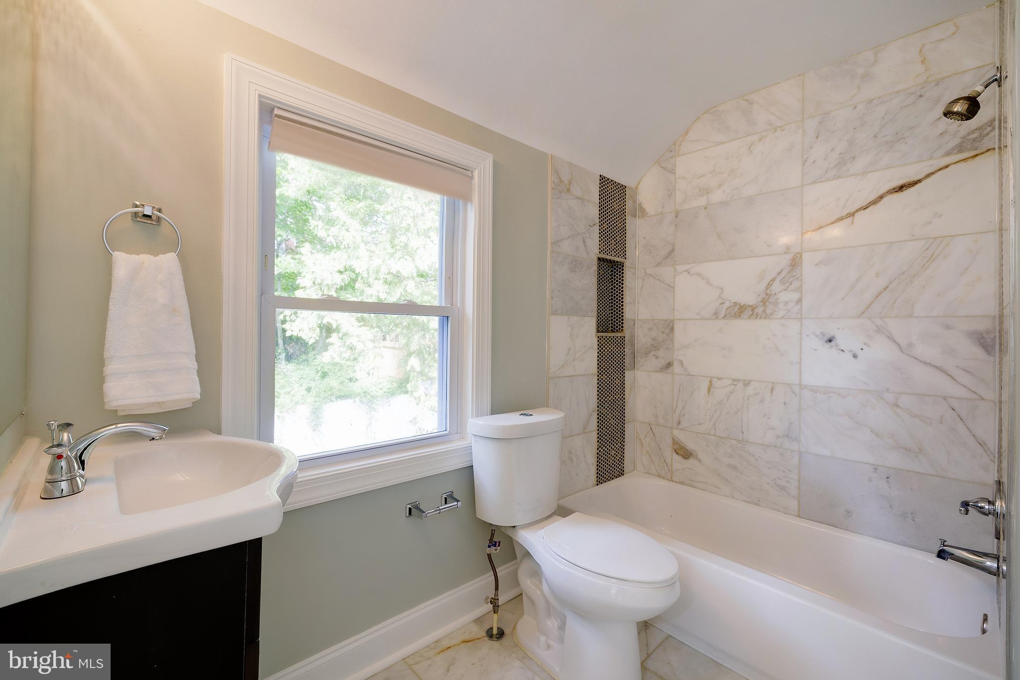 704 Maplewood Avenue Takoma Park, MD 20912 - Photo 34 of 54 a bathroom with a sink toilet tub and shower