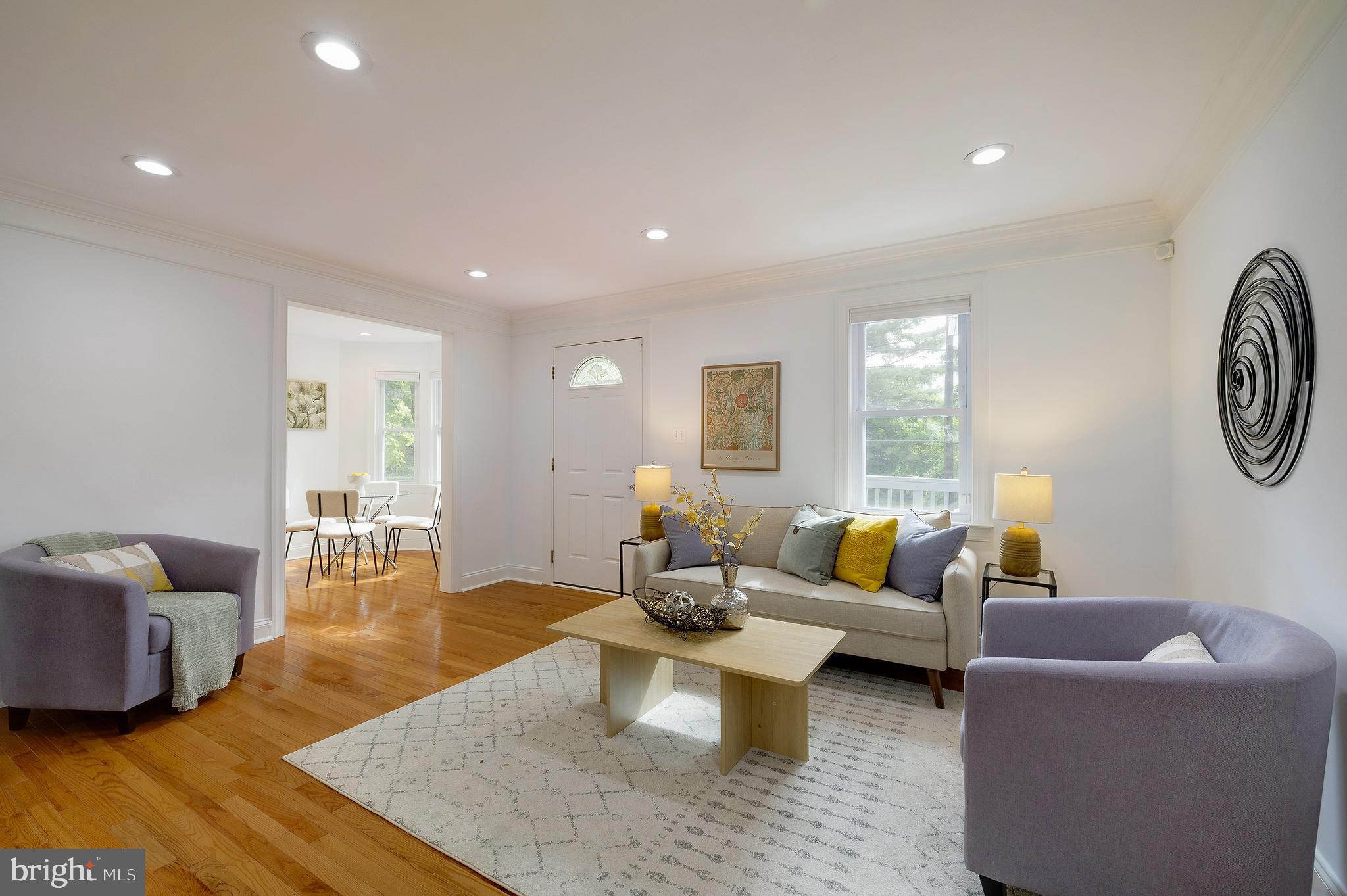 704 Maplewood Avenue Takoma Park, MD 20912 - Photo 7 of 54 a living room with furniture and a large window