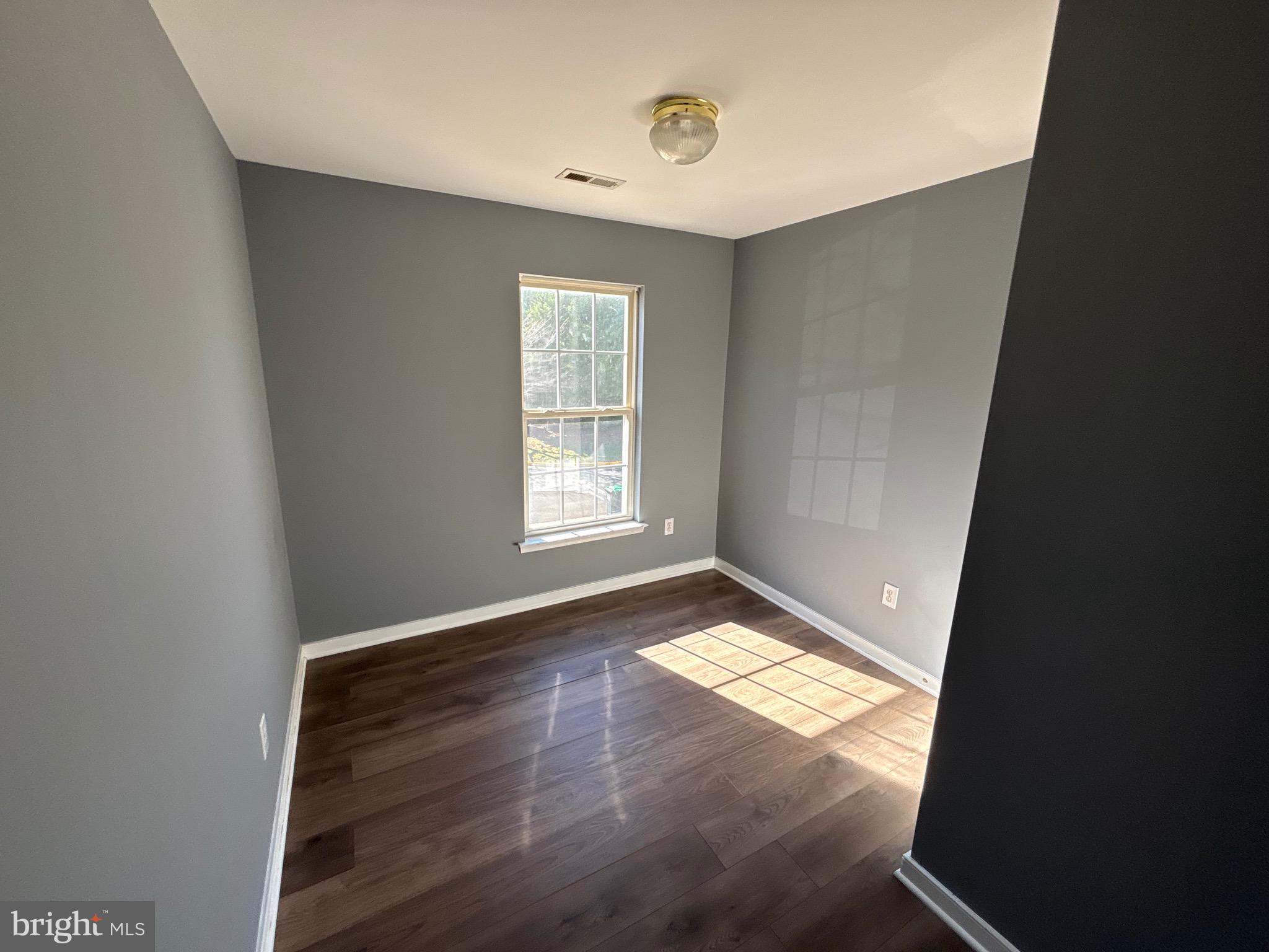 200 Torbert Loop Stafford, VA 22554 - Photo 27 of 28 an empty room with wooden floor and windows