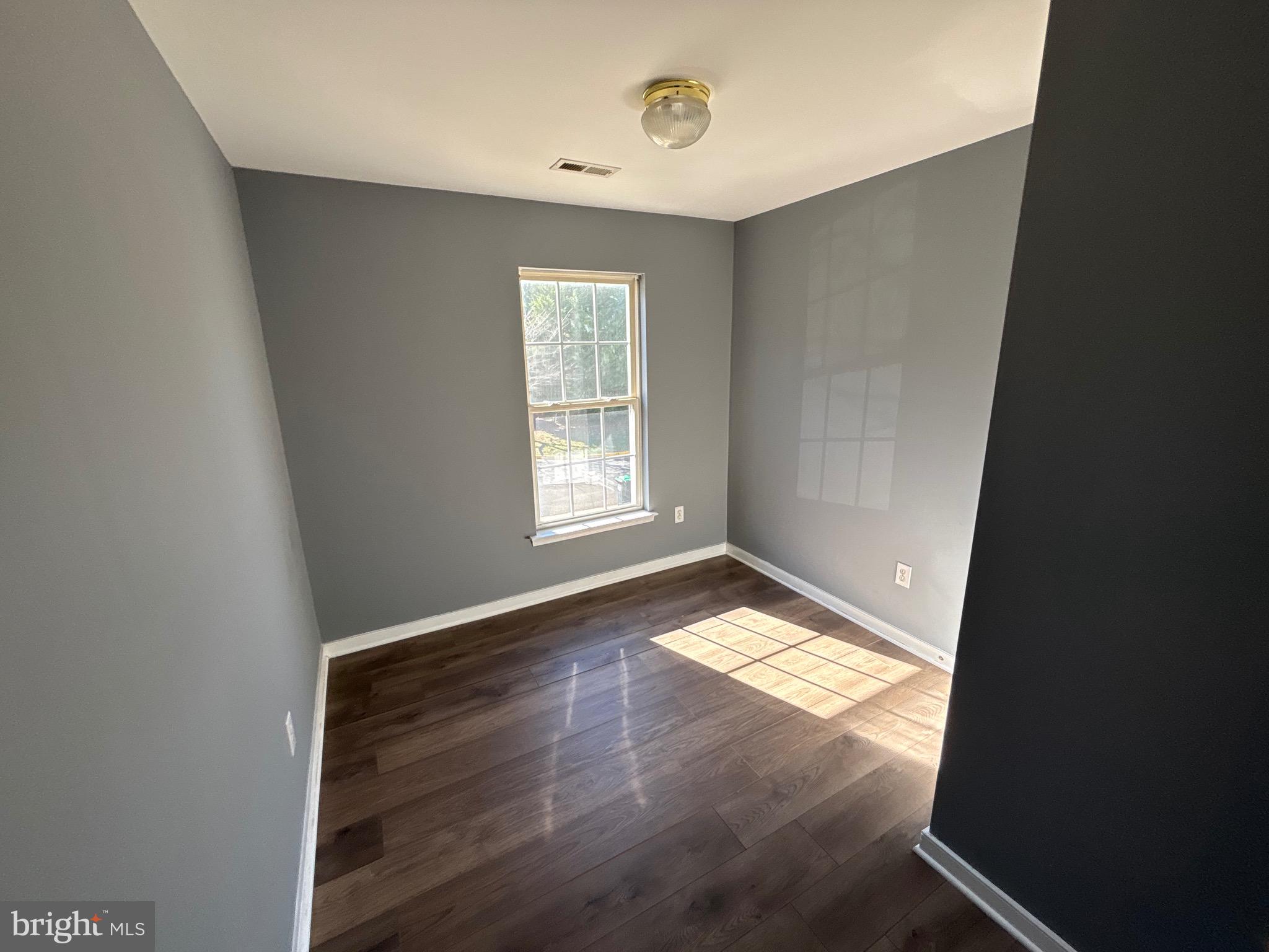 200 Torbert Loop Stafford, VA 22554 - Photo 28 of 28 an empty room with wooden floor and windows