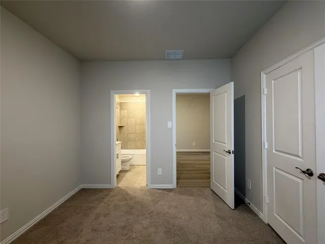 a view of kitchen with cabinets and wooden floor