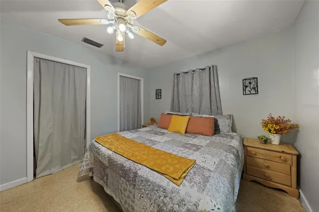 a bed room with a bed and a chandelier