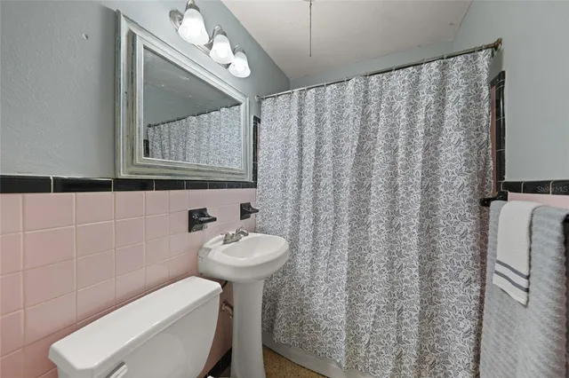 a bathroom with a toilet and a sink