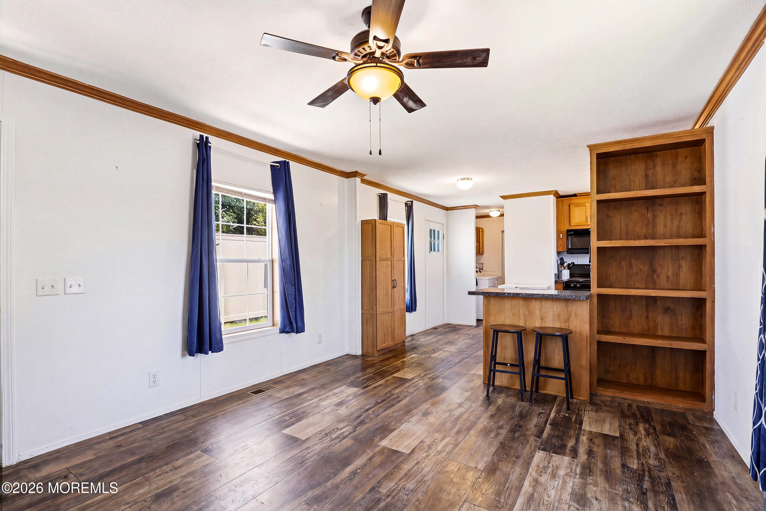 40 Locust Grove Hazlet, NJ 07730 - Photo 4 of 15 a view of a hardwood floor and a ceiling fan in a room