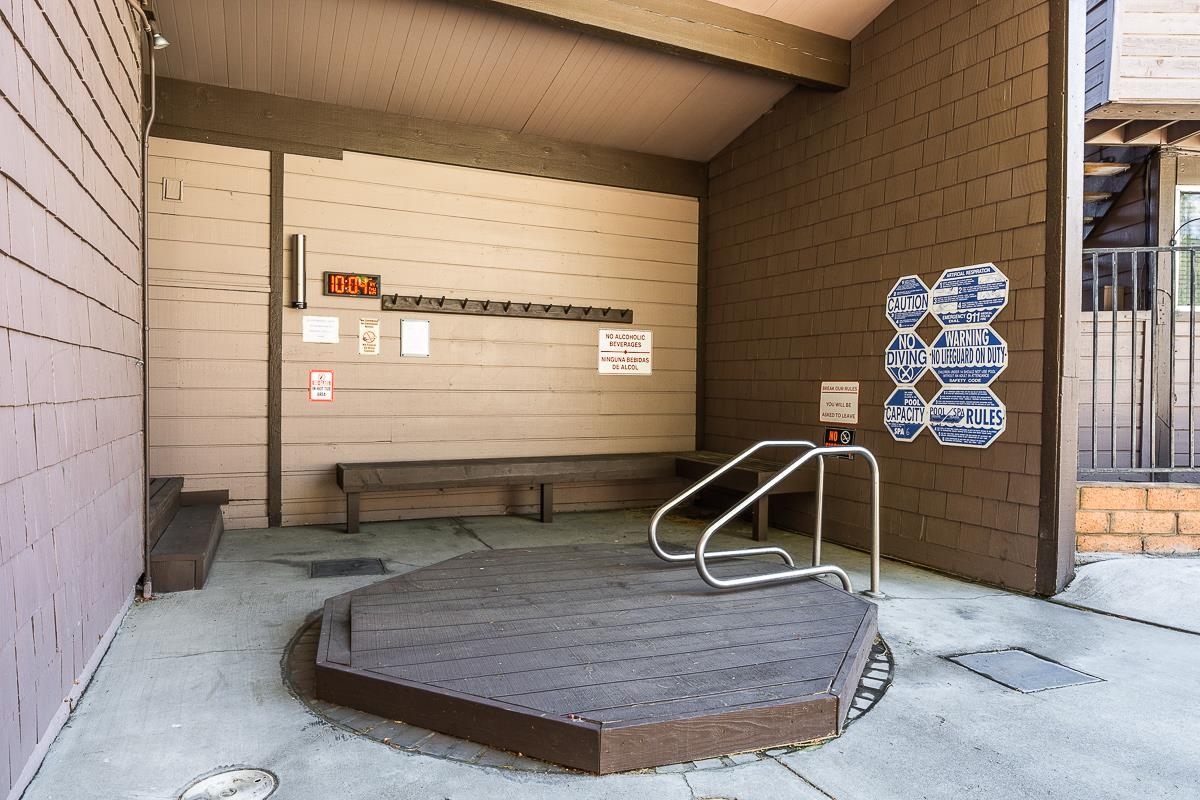165 Old Mammoth Road, Unit 3 Mammoth Lakes, CA 93546 - Photo 48 of 48 Shaded outdoor spa area featuring a hexagonal wood-finish deck with stainless steel handrails