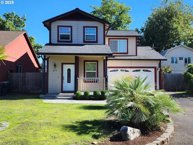 a front view of a house with garden