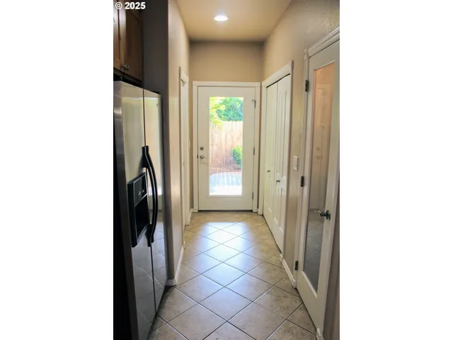 a view of a hallway with windows