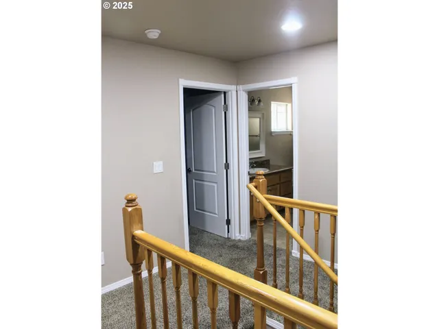 a view of a hallway with seating area